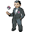 giovanni Mann im grauen Anzug mit schwarzen Haaren, hält einen Ball in der Hand.